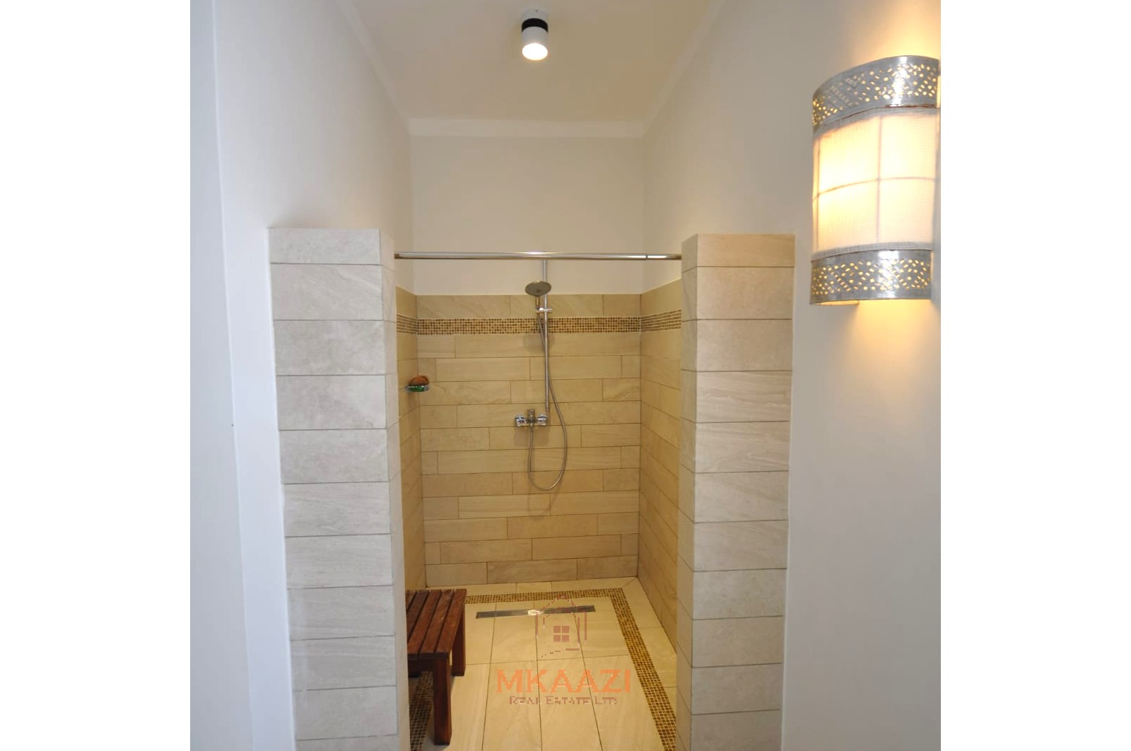 Luxury 4-bedroom villa for sale in Malindi near Casuarina Road with pool, landscaped gardens, staff quarters, and high-end finishes on 1.25 acres.