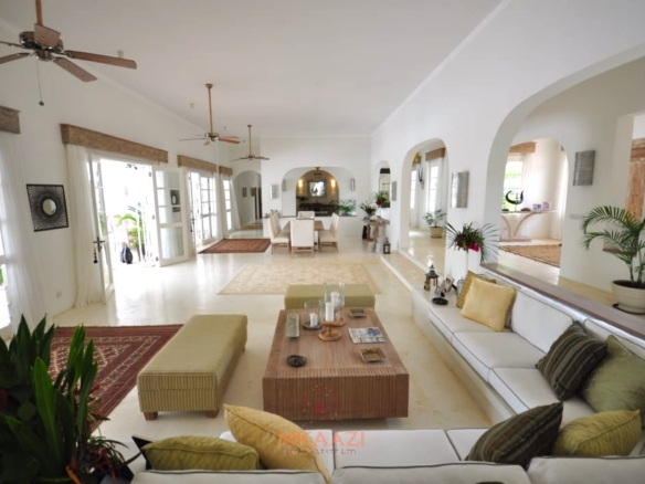 Luxury 4-bedroom villa for sale in Malindi near Casuarina Road with pool, landscaped gardens, staff quarters, and high-end finishes on 1.25 acres.