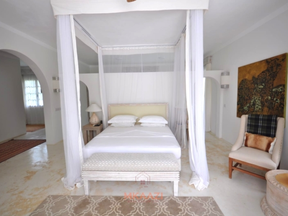 Luxury 4-bedroom villa for sale in Malindi near Casuarina Road with pool, landscaped gardens, staff quarters, and high-end finishes on 1.25 acres.