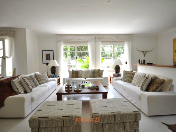 Luxury 4-bedroom villa for sale in Malindi near Casuarina Road with pool, landscaped gardens, staff quarters, and high-end finishes on 1.25 acres.