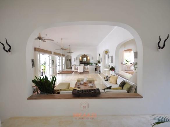 Luxury 4-bedroom villa for sale in Malindi near Casuarina Road with pool, landscaped gardens, staff quarters, and high-end finishes on 1.25 acres.