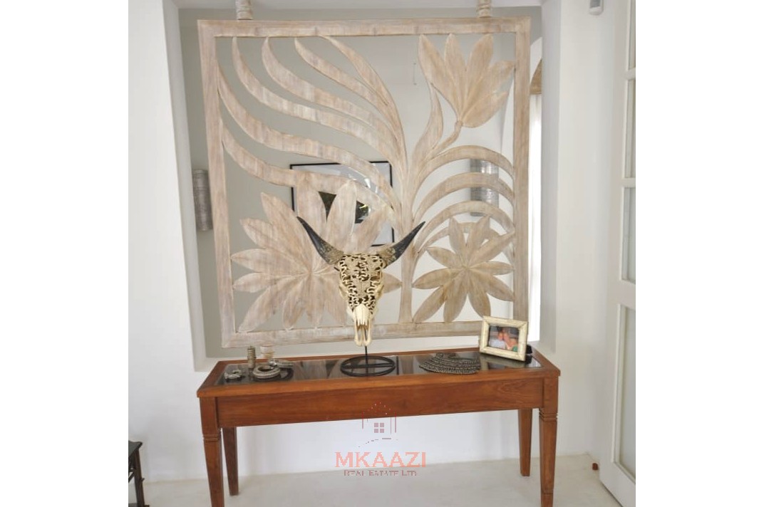 Luxury 4-bedroom villa for sale in Malindi near Casuarina Road with pool, landscaped gardens, staff quarters, and high-end finishes on 1.25 acres.