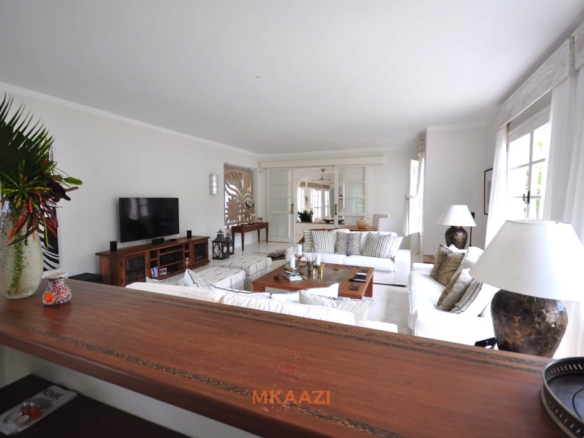 Luxury 4-bedroom villa for sale in Malindi near Casuarina Road with pool, landscaped gardens, staff quarters, and high-end finishes on 1.25 acres.