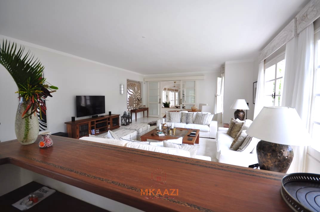 Luxury 4-bedroom villa for sale in Malindi near Casuarina Road with pool, landscaped gardens, staff quarters, and high-end finishes on 1.25 acres.