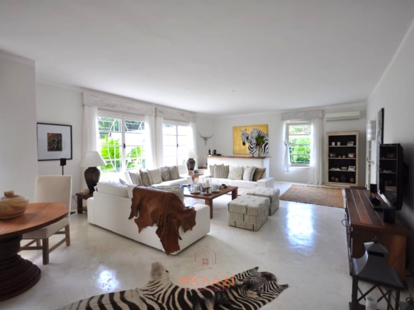 Luxury 4-bedroom villa for sale in Malindi near Casuarina Road with pool, landscaped gardens, staff quarters, and high-end finishes on 1.25 acres.