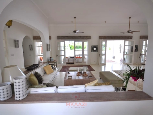 Luxury 4-bedroom villa for sale in Malindi near Casuarina Road with pool, landscaped gardens, staff quarters, and high-end finishes on 1.25 acres.