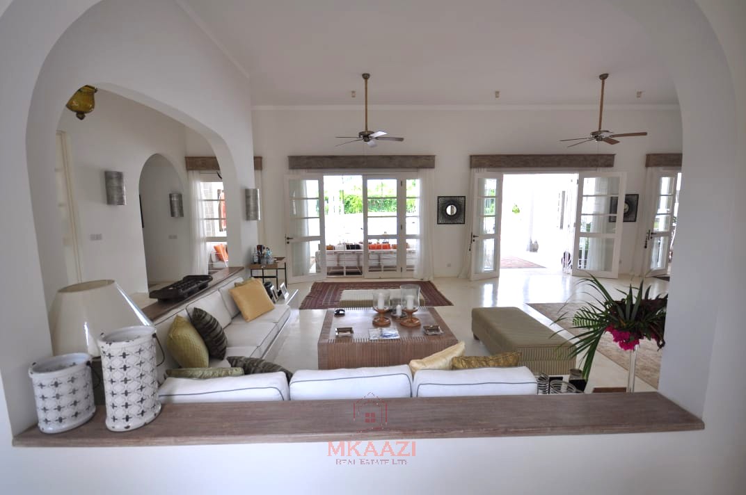 Luxury 4-bedroom villa for sale in Malindi near Casuarina Road with pool, landscaped gardens, staff quarters, and high-end finishes on 1.25 acres.