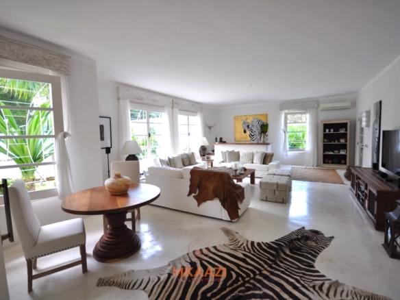 Luxury 4-bedroom villa for sale in Malindi near Casuarina Road with pool, landscaped gardens, staff quarters, and high-end finishes on 1.25 acres.