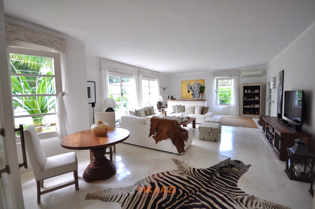 Luxury 4-bedroom villa for sale in Malindi near Casuarina Road with pool, landscaped gardens, staff quarters, and high-end finishes on 1.25 acres.