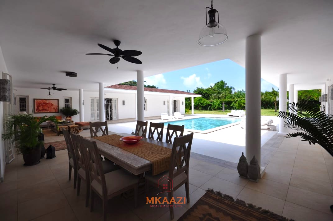 Luxury 4-bedroom villa for sale in Malindi near Casuarina Road with pool, landscaped gardens, staff quarters, and high-end finishes on 1.25 acres.