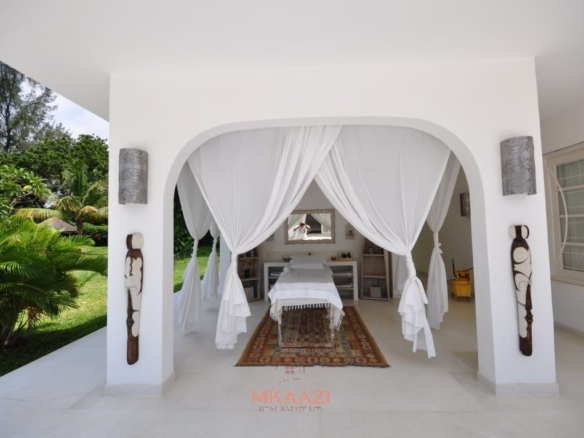 Luxury 4-bedroom villa for sale in Malindi near Casuarina Road with pool, landscaped gardens, staff quarters, and high-end finishes on 1.25 acres.