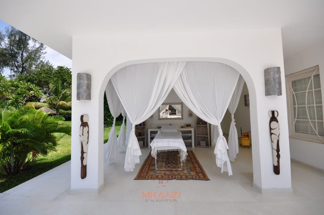 Luxury 4-bedroom villa for sale in Malindi near Casuarina Road with pool, landscaped gardens, staff quarters, and high-end finishes on 1.25 acres.