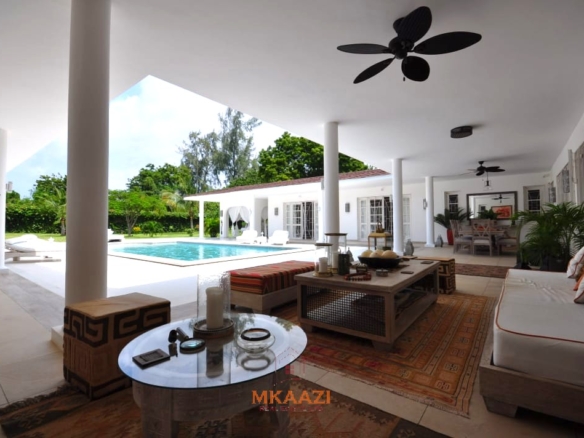 Luxury 4-bedroom villa for sale in Malindi near Casuarina Road with pool, landscaped gardens, staff quarters, and high-end finishes on 1.25 acres.