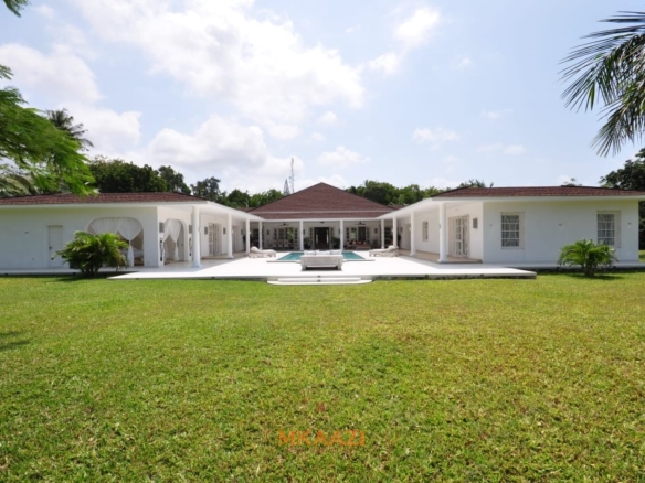 Luxury 4-bedroom villa for sale in Malindi near Casuarina Road with pool, landscaped gardens, staff quarters, and high-end finishes on 1.25 acres.