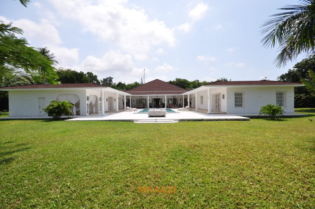 Luxury 4-bedroom villa for sale in Malindi near Casuarina Road with pool, landscaped gardens, staff quarters, and high-end finishes on 1.25 acres.