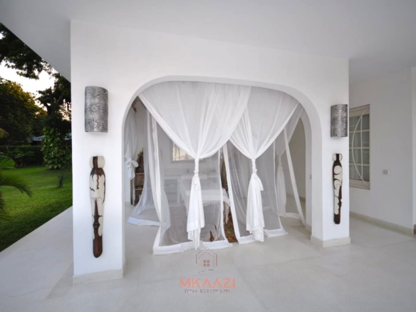 Luxury 4-bedroom villa for sale in Malindi near Casuarina Road with pool, landscaped gardens, staff quarters, and high-end finishes on 1.25 acres.