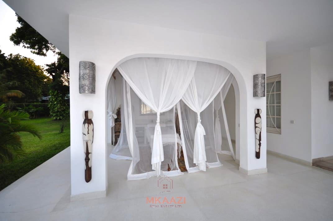 Luxury 4-bedroom villa for sale in Malindi near Casuarina Road with pool, landscaped gardens, staff quarters, and high-end finishes on 1.25 acres.