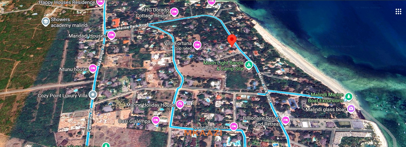 Luxury 4-bedroom en-suite villa for sale near Marine Park Road Malindi with shared pool, private garden, and makuti roof.