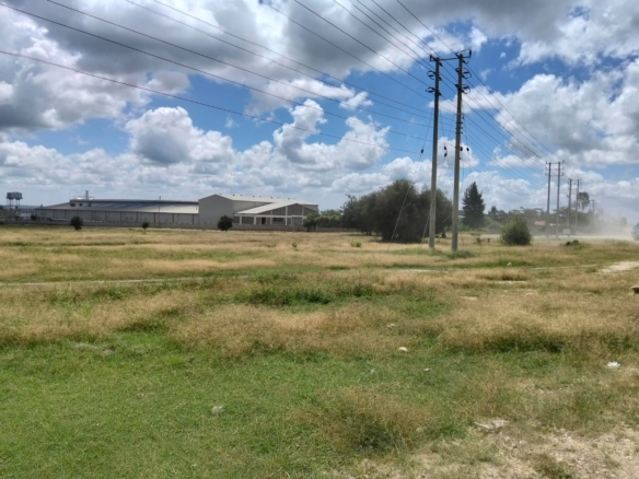 Prime 50-acre road frontage land for sale in Kitengela Kisaju ideal for industrial, commercial, residential estate, and mixed-use development with ready title deed.