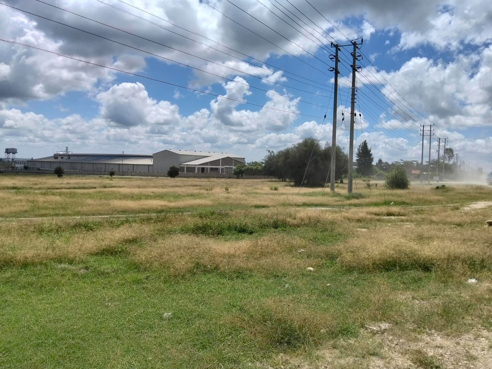Prime 50-acre road frontage land for sale in Kitengela Kisaju ideal for industrial, commercial, residential estate, and mixed-use development with ready title deed.
