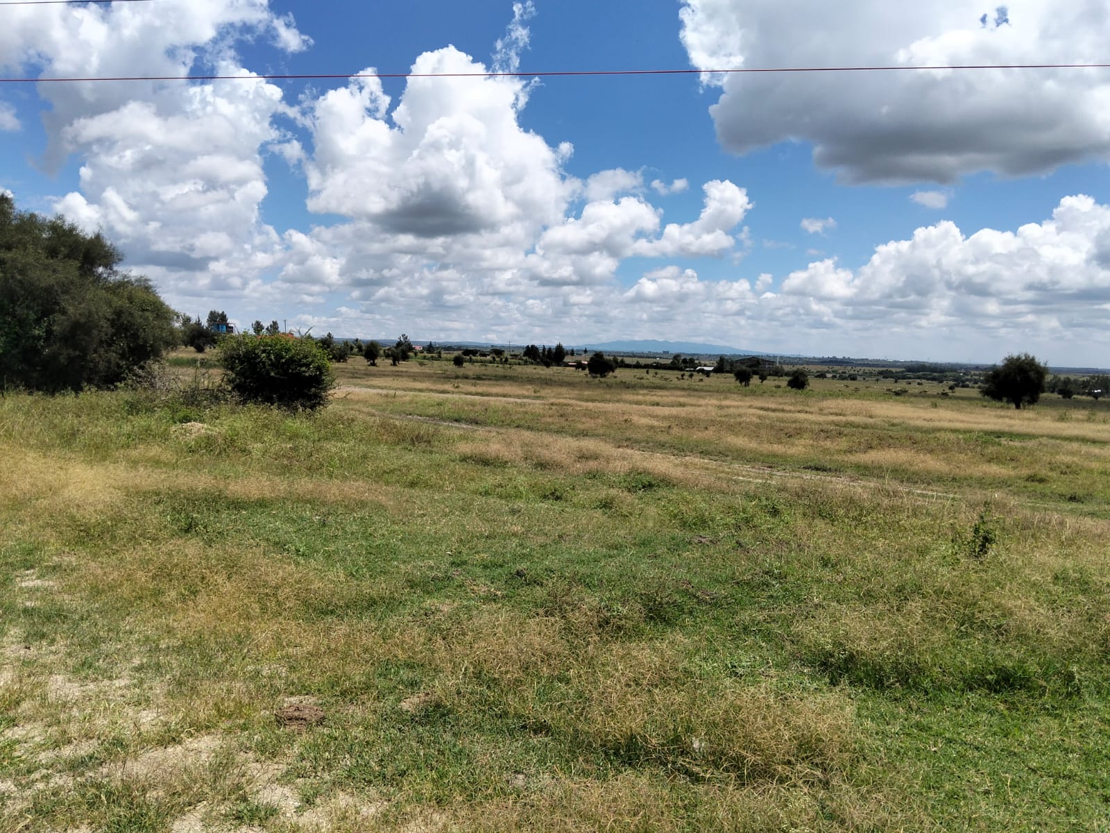 Prime 50-acre road frontage land for sale in Kitengela Kisaju ideal for industrial, commercial, residential estate, and mixed-use development with ready title deed.