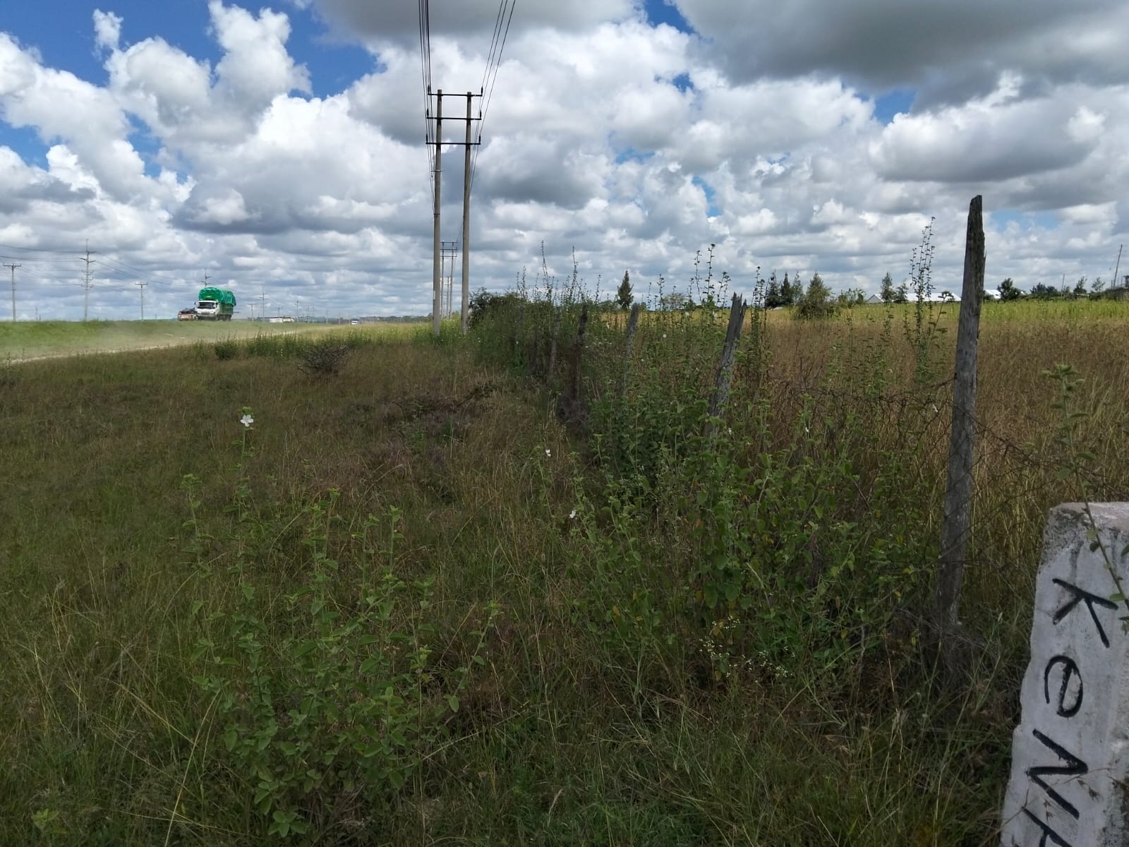 Prime 50-acre road frontage land for sale in Kitengela Kisaju ideal for industrial, commercial, residential estate, and mixed-use development with ready title deed.