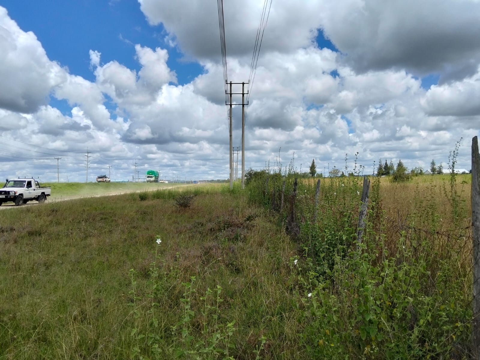 Prime 50-acre road frontage land for sale in Kitengela Kisaju ideal for industrial, commercial, residential estate, and mixed-use development with ready title deed.