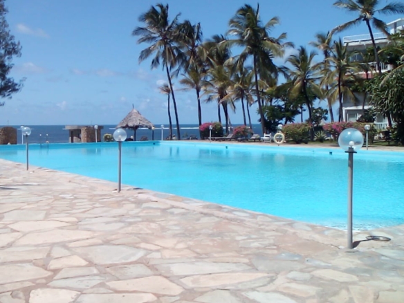 Beachfront 1 bedroom apartment for sale in Oasis Village Malindi with ocean and pool views