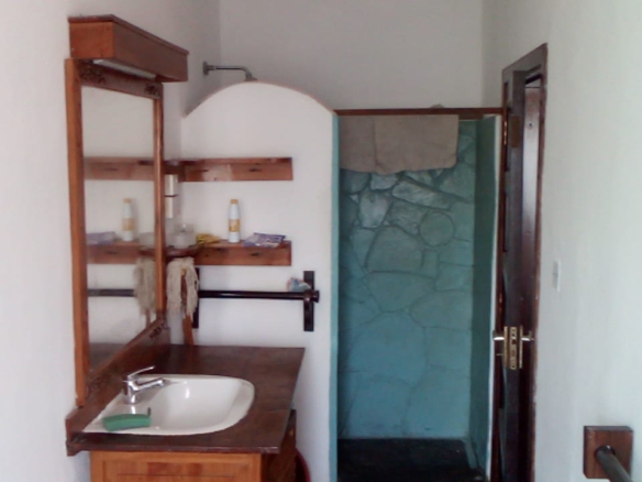 Beachfront 1 bedroom apartment for sale in Oasis Village Malindi with ocean and pool views