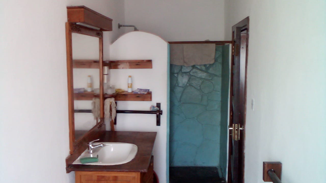 Beachfront 1 bedroom apartment for sale in Oasis Village Malindi with ocean and pool views