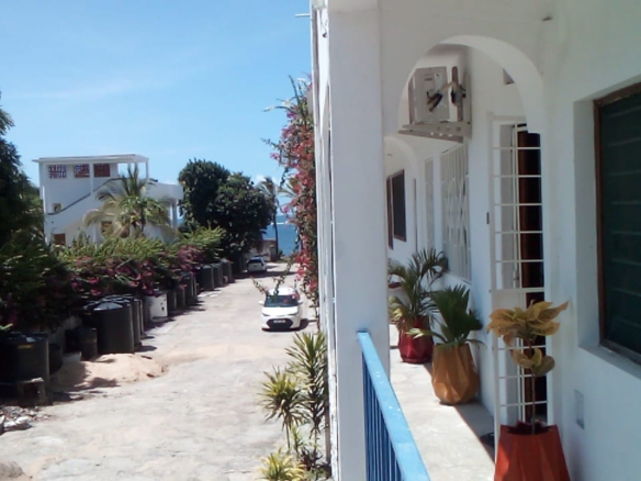 Beachfront 1 bedroom apartment for sale in Oasis Village Malindi with ocean and pool views