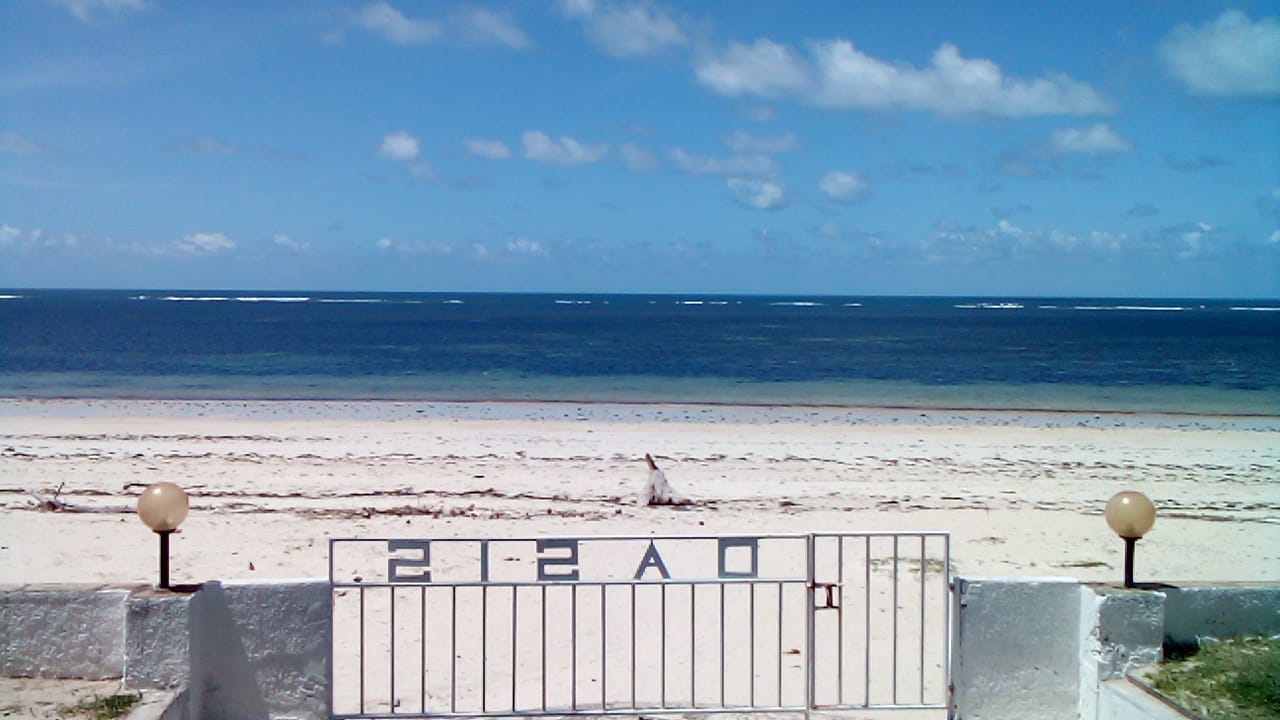 Beachfront 1 bedroom apartment for sale in Oasis Village Malindi with ocean and pool views