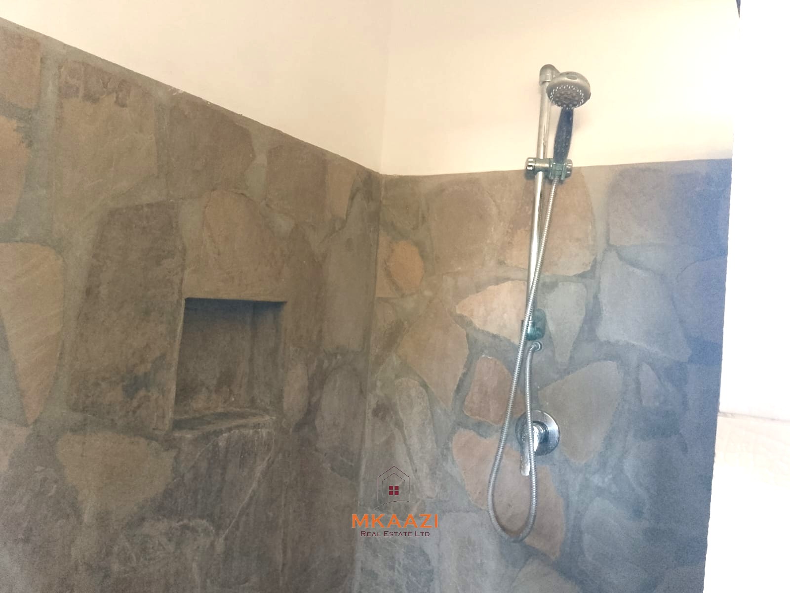 Luxury 4-bedroom en-suite villa for sale near Marine Park Road Malindi with shared pool, private garden, and makuti roof.