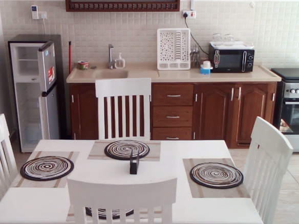 Luxury beachfront 2-bedroom apartment for short stay in Oasis Village Malindi with ocean views, swimming pool, secure parking, and 24/7 security.