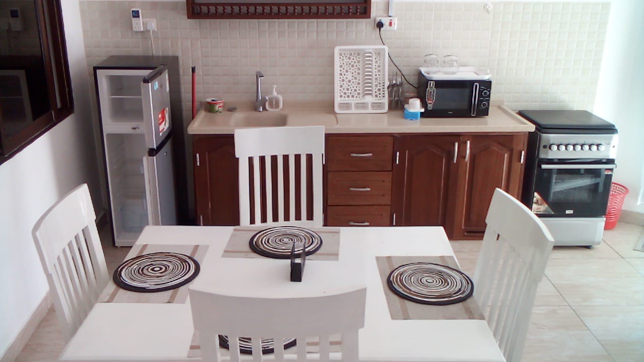 Luxury beachfront 2-bedroom apartment for short stay in Oasis Village Malindi with ocean views, swimming pool, secure parking, and 24/7 security.