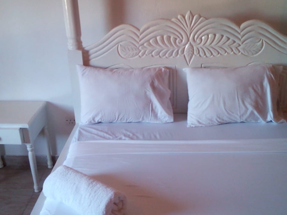 Luxury beachfront 2-bedroom apartment for short stay in Oasis Village Malindi with ocean views, swimming pool, secure parking, and 24/7 security.