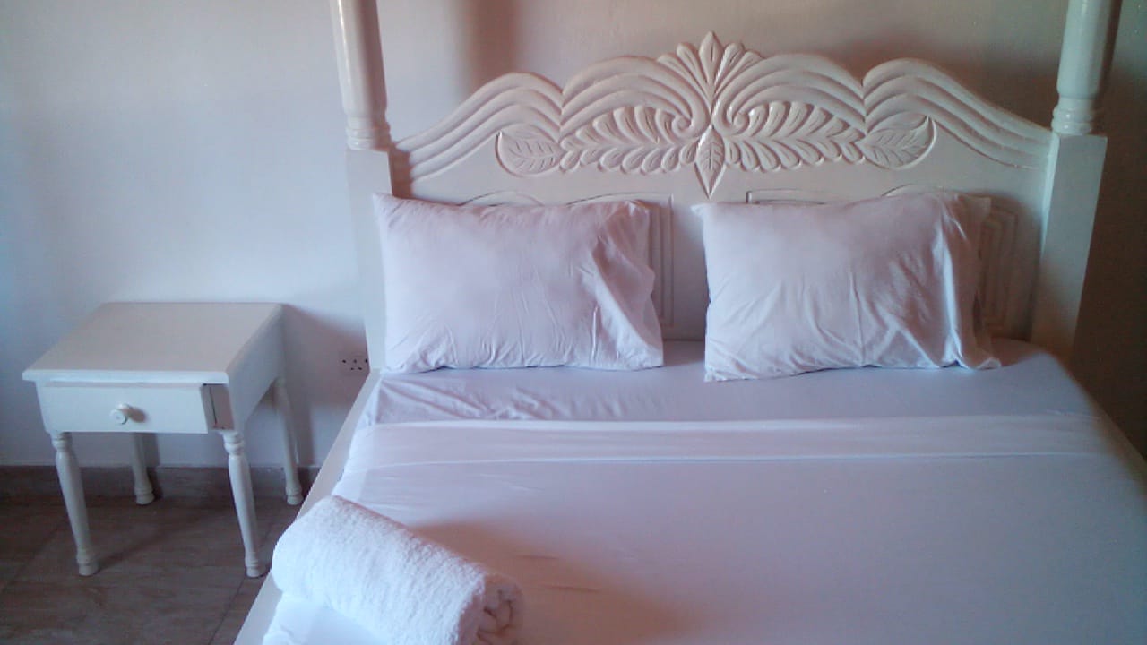 Luxury beachfront 2-bedroom apartment for short stay in Oasis Village Malindi with ocean views, swimming pool, secure parking, and 24/7 security.