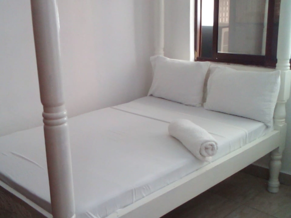 Luxury beachfront 2-bedroom apartment for short stay in Oasis Village Malindi with ocean views, swimming pool, secure parking, and 24/7 security.