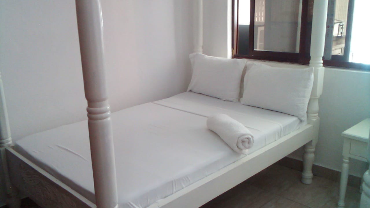 Luxury beachfront 2-bedroom apartment for short stay in Oasis Village Malindi with ocean views, swimming pool, secure parking, and 24/7 security.