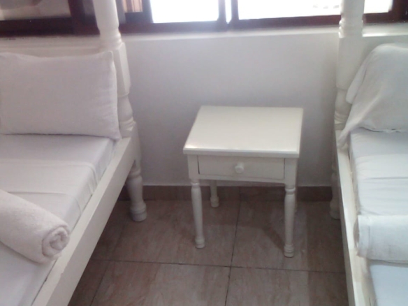 Luxury beachfront 2-bedroom apartment for short stay in Oasis Village Malindi with ocean views, swimming pool, secure parking, and 24/7 security.
