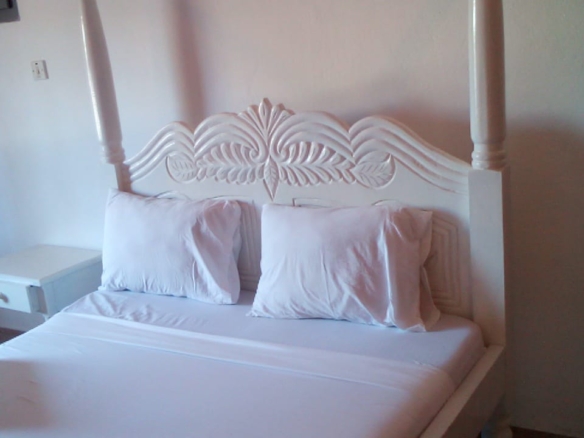 Luxury beachfront 2-bedroom apartment for short stay in Oasis Village Malindi with ocean views, swimming pool, secure parking, and 24/7 security.