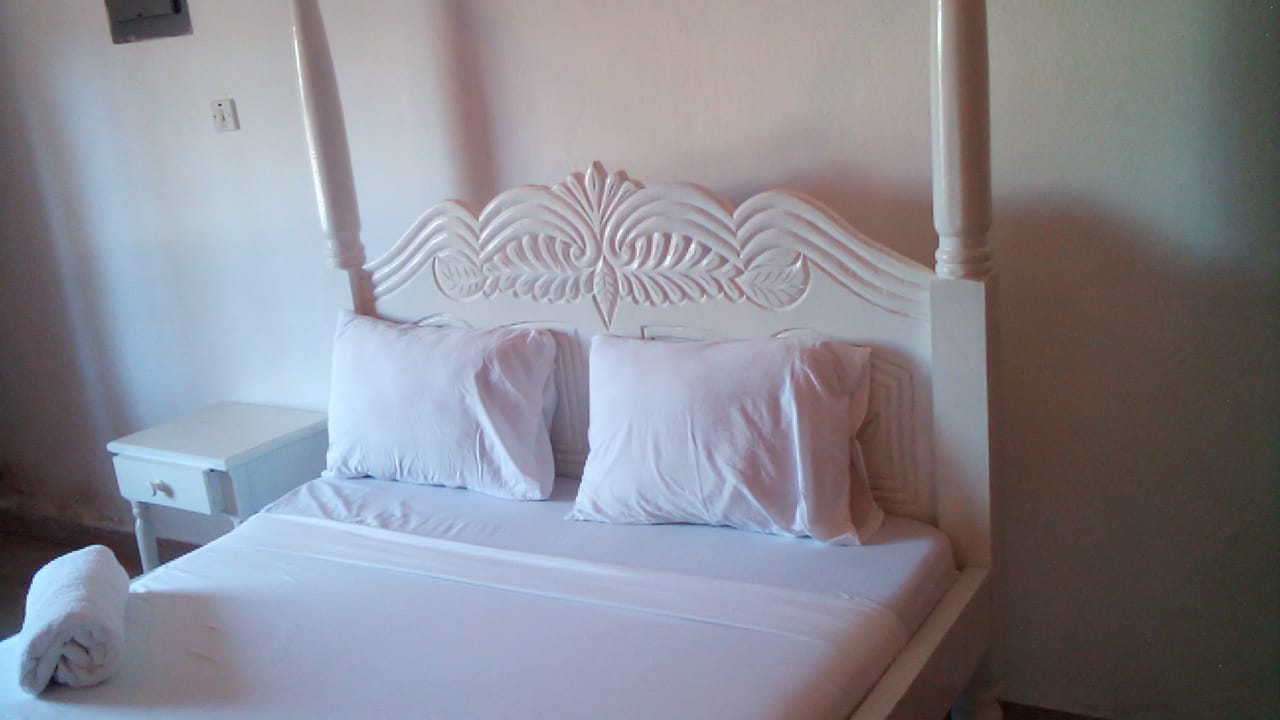 Luxury beachfront 2-bedroom apartment for short stay in Oasis Village Malindi with ocean views, swimming pool, secure parking, and 24/7 security.