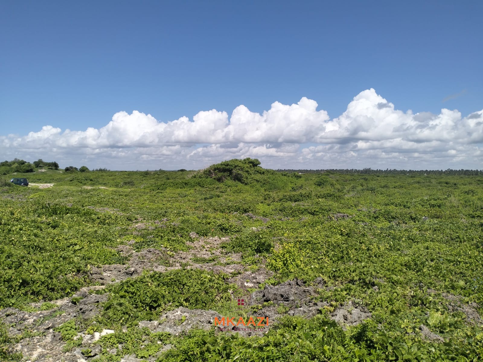 3-acre cliffside beachfront land for sale in Uyombo with sandy beach access and panoramic Indian Ocean views.