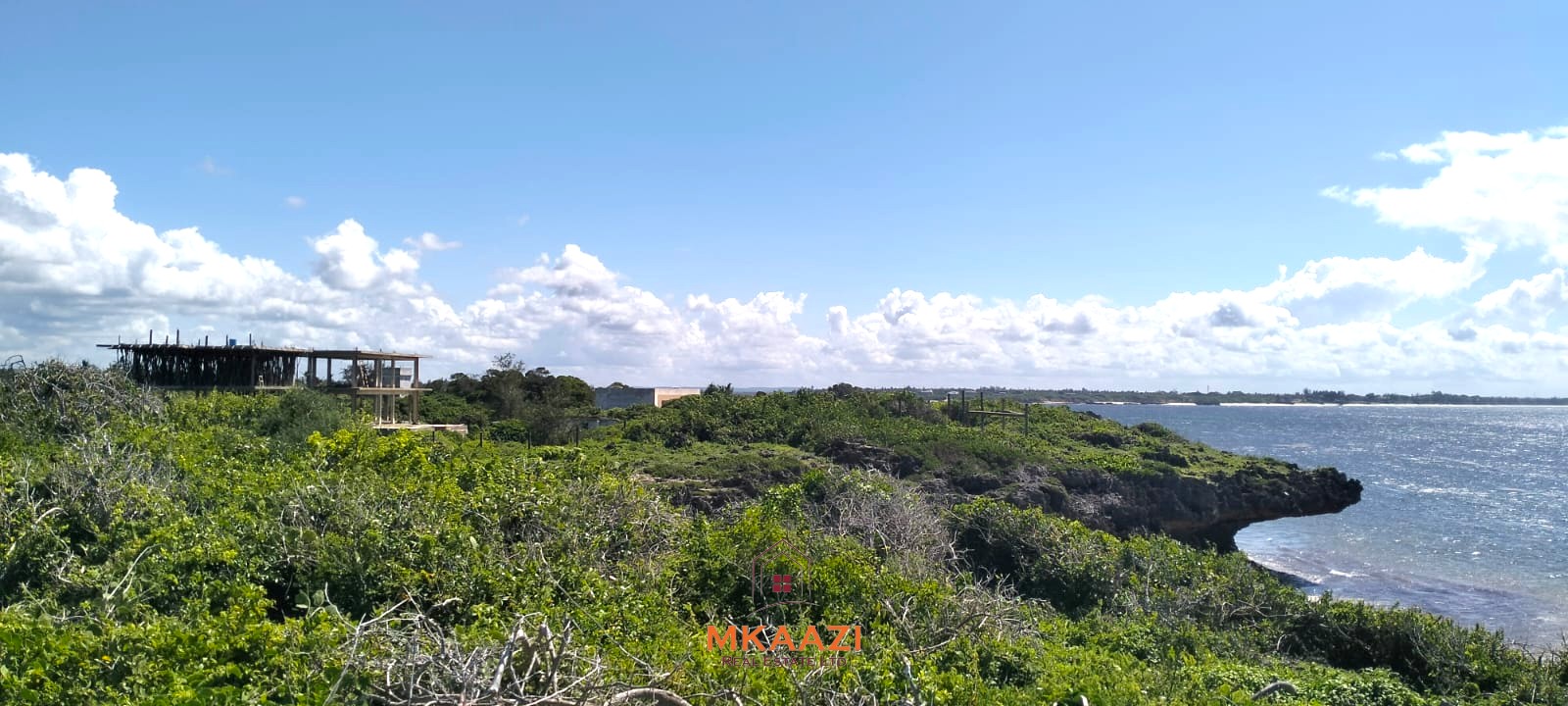 3-acre cliffside beachfront land for sale in Uyombo with sandy beach access and panoramic Indian Ocean views.