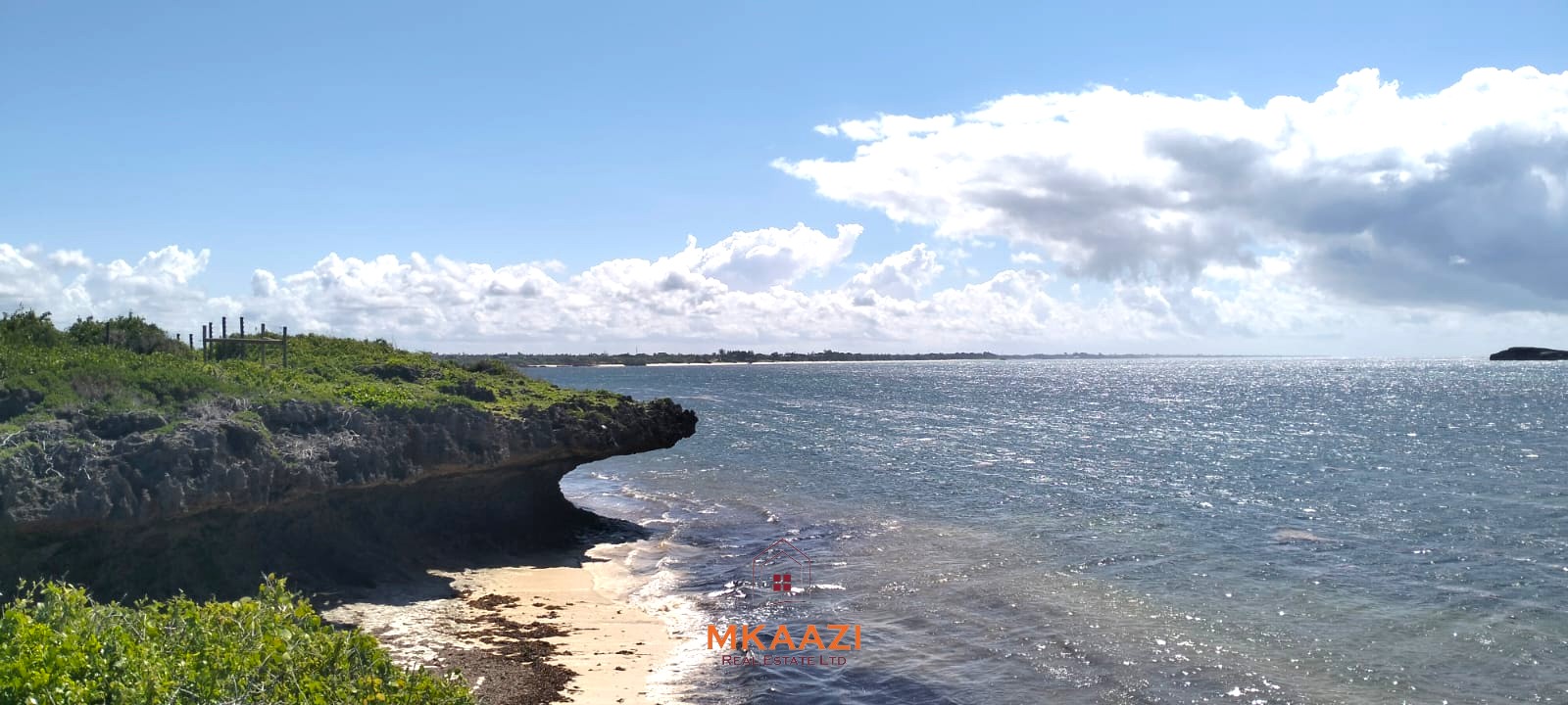 3-acre cliffside beachfront land for sale in Uyombo with sandy beach access and panoramic Indian Ocean views.