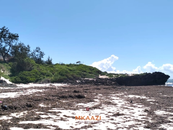 5-acre beachfront land for sale in Uyombo featuring sandy beachfront access, freehold title deed, coral bedrock foundation, and prime investment potential along Kenya’s North Coast.