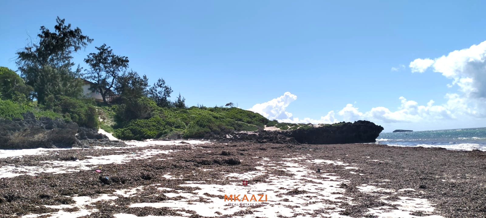 5-acre beachfront land for sale in Uyombo featuring sandy beachfront access, freehold title deed, coral bedrock foundation, and prime investment potential along Kenya’s North Coast.
