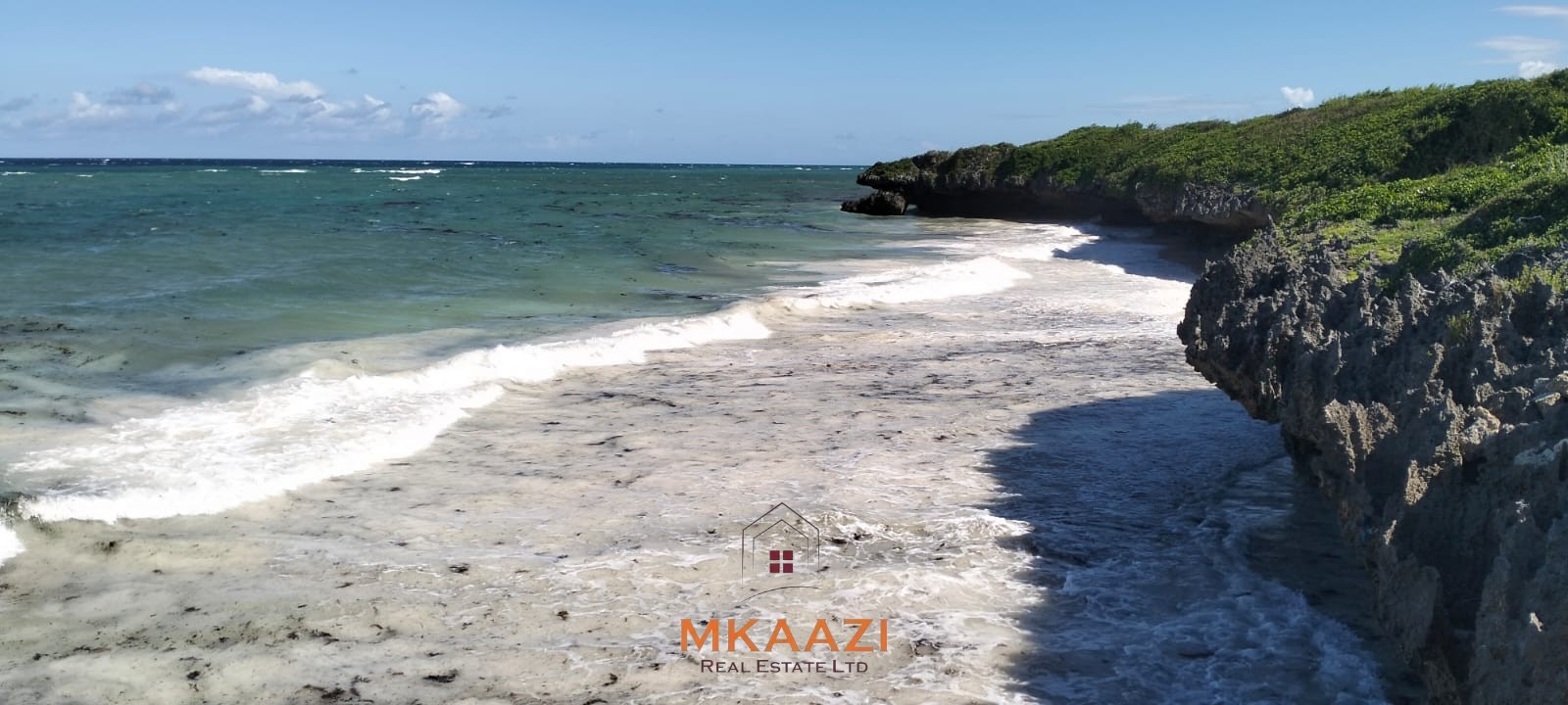 20-acre beachfront land for sale in Chumani featuring sandy beach access, gated and walled boundaries, coral bedrock foundation, and premium investment potential.