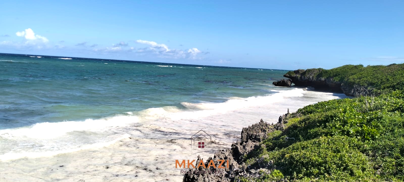 20-acre beachfront land for sale in Chumani featuring sandy beach access, gated and walled boundaries, coral bedrock foundation, and premium investment potential.