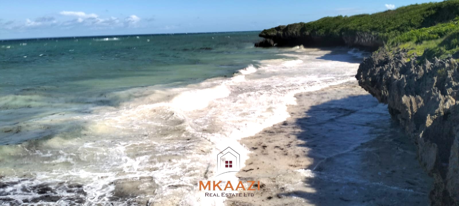 20-acre beachfront land for sale in Chumani featuring sandy beach access, gated and walled boundaries, coral bedrock foundation, and premium investment potential.